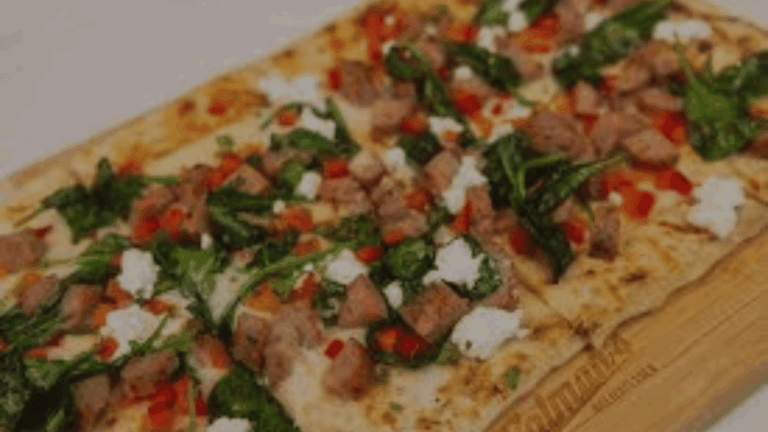 Baked Mediterranean Flatbread Delight with Spinach, Mozzarella, and Feta
