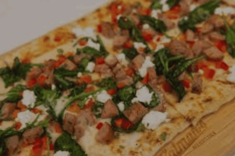 Baked Mediterranean Flatbread Delight with Spinach, Mozzarella, and Feta